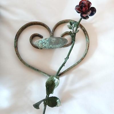 Beautiful tin vase with rose and hanging iron heart with rose candle holder