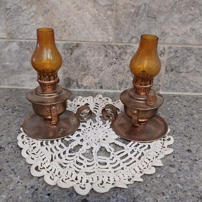 Two miniature oil lanterns with a knit Doiley - lanterns will really work with added oil!