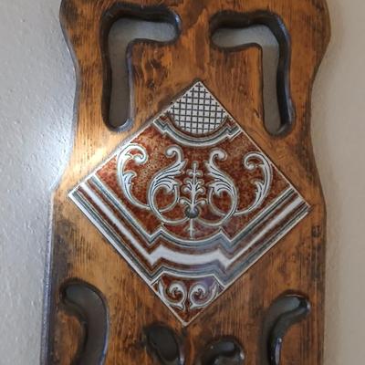 Long wall hanging wooden plant shelf with beautiful tile accent