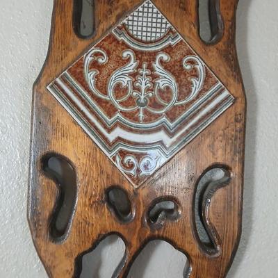 Long wall hanging wooden plant shelf with beautiful tile accent