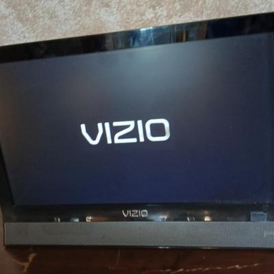 Working 19" Vizio Television with small media storage stand
