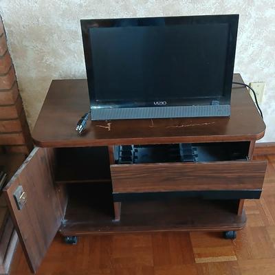 Working 19" Vizio Television with small media storage stand