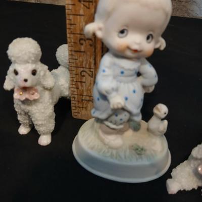 Vintage JAPAN marked poodle figures and a little girl with a goose.