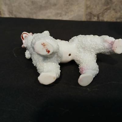 Vintage JAPAN marked poodle figures and a little girl with a goose.