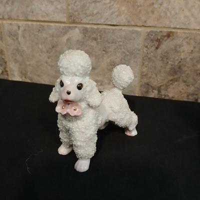 Vintage JAPAN marked poodle figures and a little girl with a goose.