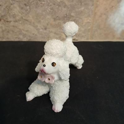 Vintage JAPAN marked poodle figures and a little girl with a goose.