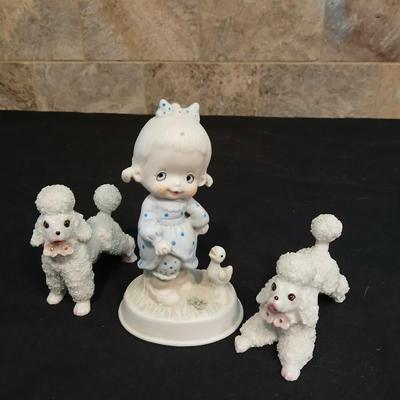 Vintage JAPAN marked poodle figures and a little girl with a goose.