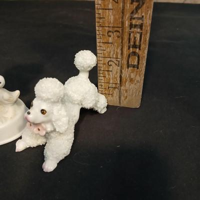 Vintage JAPAN marked poodle figures and a little girl with a goose.