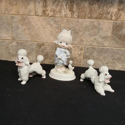 Vintage JAPAN marked poodle figures and a little girl with a goose.