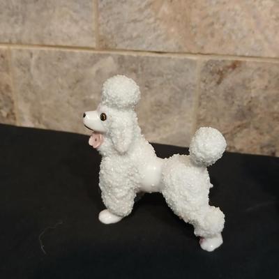 Vintage JAPAN marked poodle figures and a little girl with a goose.