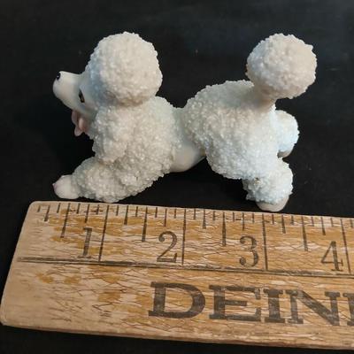 Vintage JAPAN marked poodle figures and a little girl with a goose.