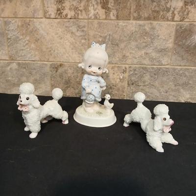 Vintage JAPAN marked poodle figures and a little girl with a goose.
