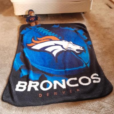 Broncos throw blanket with Broncos teddy bear