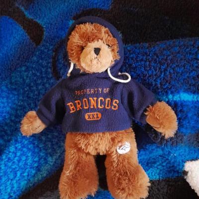 Broncos throw blanket with Broncos teddy bear