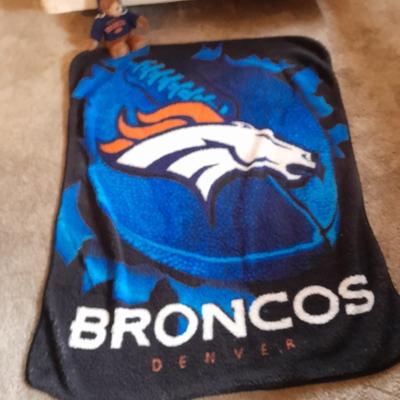 Broncos throw blanket with Broncos teddy bear