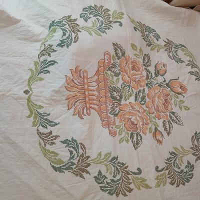 Embroidered floral quilt with soft blue blanket