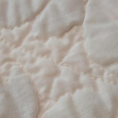 Embroidered floral quilt with soft blue blanket