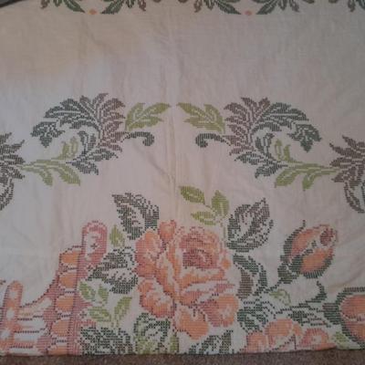 Embroidered floral quilt with soft blue blanket
