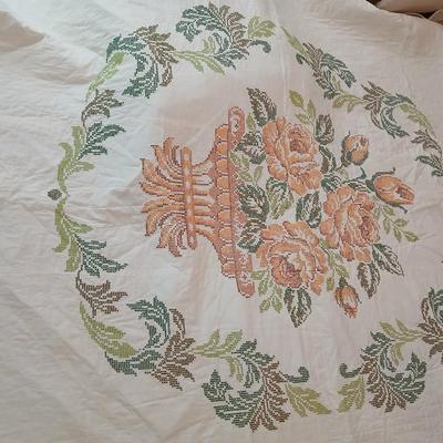 Embroidered floral quilt with soft blue blanket
