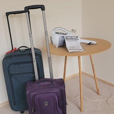 Luggage, cordless vac, table