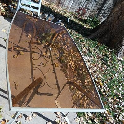 SMOKEY GLASS TOP PATIO TABLE AND TWO BIG EASY ROCKING CHAIRS