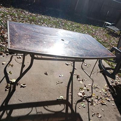 SMOKEY GLASS TOP PATIO TABLE AND TWO BIG EASY ROCKING CHAIRS