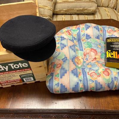 Navy hat, crate, chair cushion