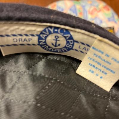 Navy hat, crate, chair cushion