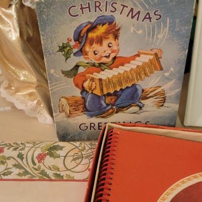 Candle, wreath, books cards