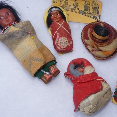 GROUPING OF FIVE SMALLER SIZE SKOOKUM DOLLS OF CHILDREN & HAND WOVEN SPLINT BASKET OF 8"