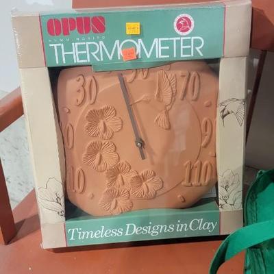 Orange wood bench, outdoor thermometer