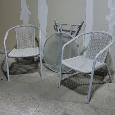 Two outdoor chairs and table