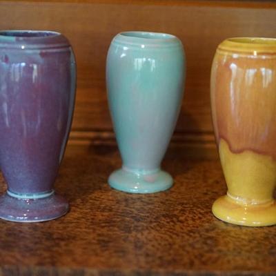 GROUPING OF FOUR 5" COLORFUL GLAZED PITTSVILLE VASES.