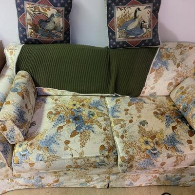 Mid century modern loveseat and your grandma's knitted throw