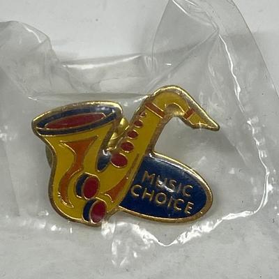 MUSIC CHOICE saxophone shaped collector’s pin
