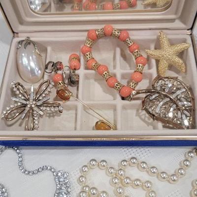 Assorted custom jewelry, blue jewelry box