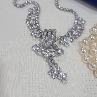 Assorted custom jewelry, blue jewelry box