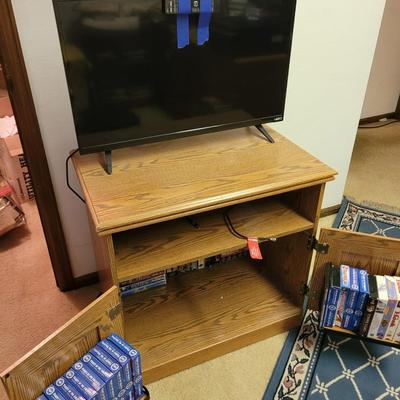 Vhs lot, tv stand and 32" tv