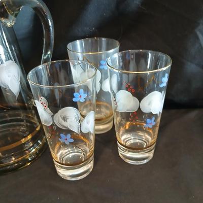 Hand painted glass pitcher with six matching hand painted drinking glasses