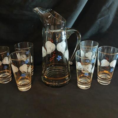 Hand painted glass pitcher with six matching hand painted drinking glasses