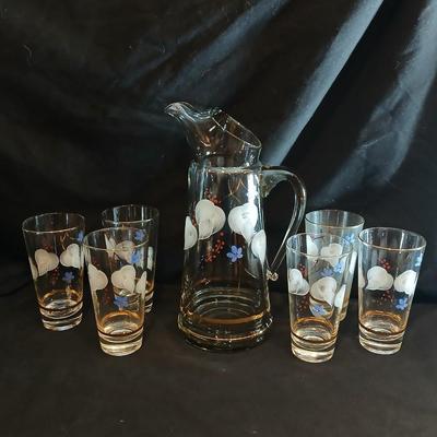 Hand painted glass pitcher with six matching hand painted drinking glasses