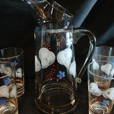 Hand painted glass pitcher with six matching hand painted drinking glasses