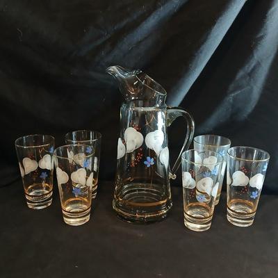 Hand painted glass pitcher with six matching hand painted drinking glasses