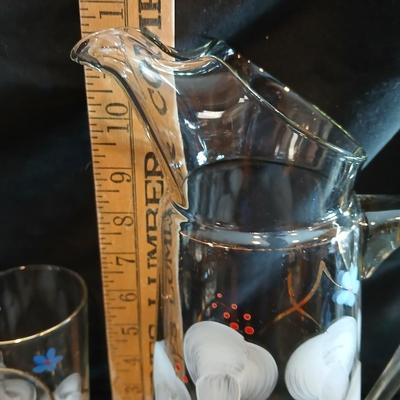 Hand painted glass pitcher with six matching hand painted drinking glasses