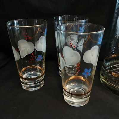 Hand painted glass pitcher with six matching hand painted drinking glasses