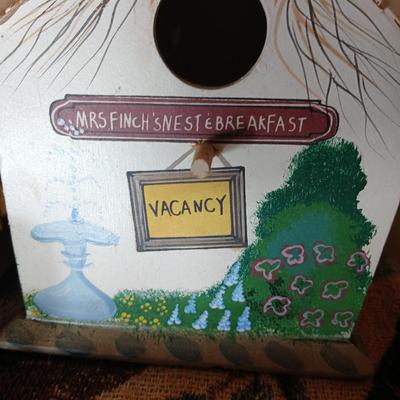 Mrs. Finch's Nest & Breakfast birdhouse with birdhouse throw blanket and wooden birdhouse basket with faux flowers