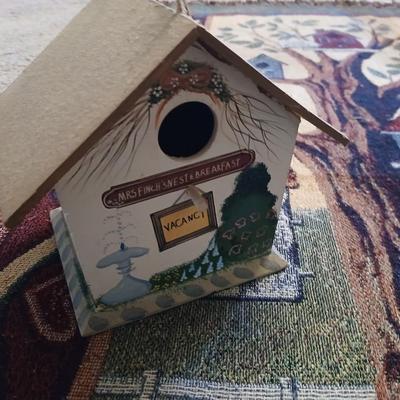 Mrs. Finch's Nest & Breakfast birdhouse with birdhouse throw blanket and wooden birdhouse basket with faux flowers