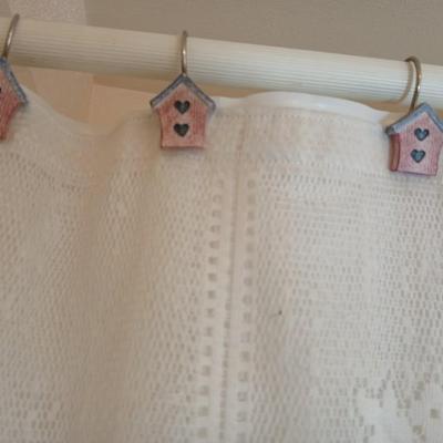 Bathroom rugs, lace shower curtain, with birdhouse hooks and a heating pad