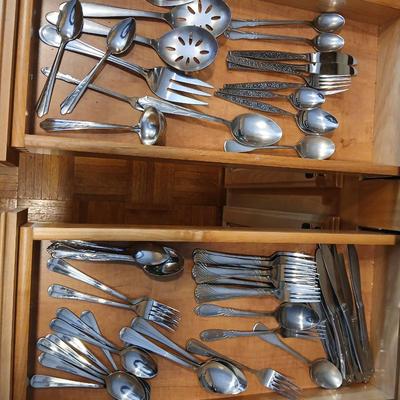 Assortment of flatware that doesn't all match - forks - spoons - butter knives - serving utensils 50 +
