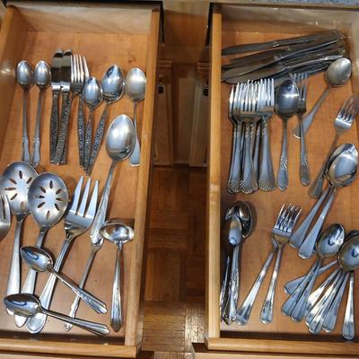 Assortment of flatware that doesn't all match - forks - spoons - butter knives - serving utensils 50 +